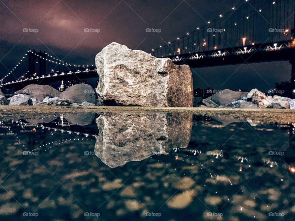 Reflection shot of the Manhattan Bridge in the PM hours