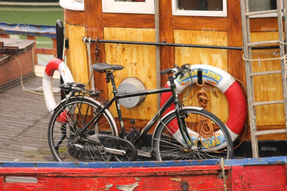 Boat bicycle . Transport along the docks 
