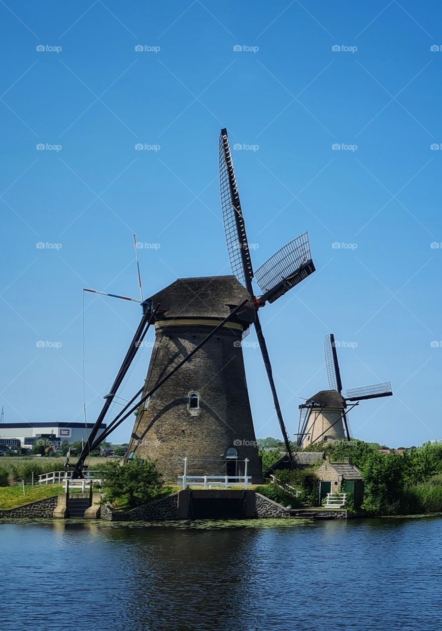 Windmills in a beautiful landscape on Kinderdijk in the Netherlands take your breath away