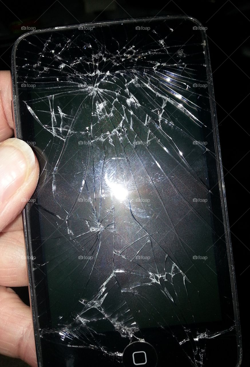 Broken ipod that's been ran over by a car