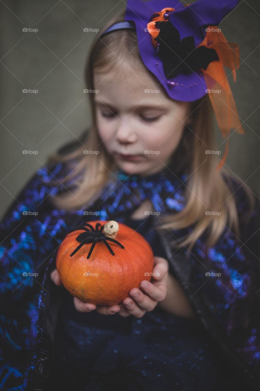 Girl and pumpkin with spider 