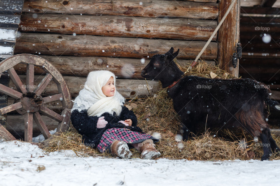 Cute kid in russian village at winter