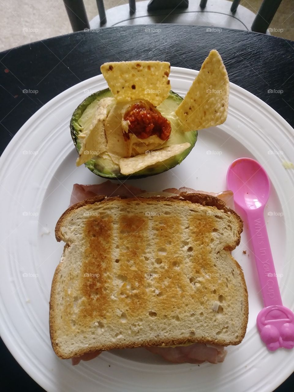 poop mb lunch of sandwich and avocado chips and hummus