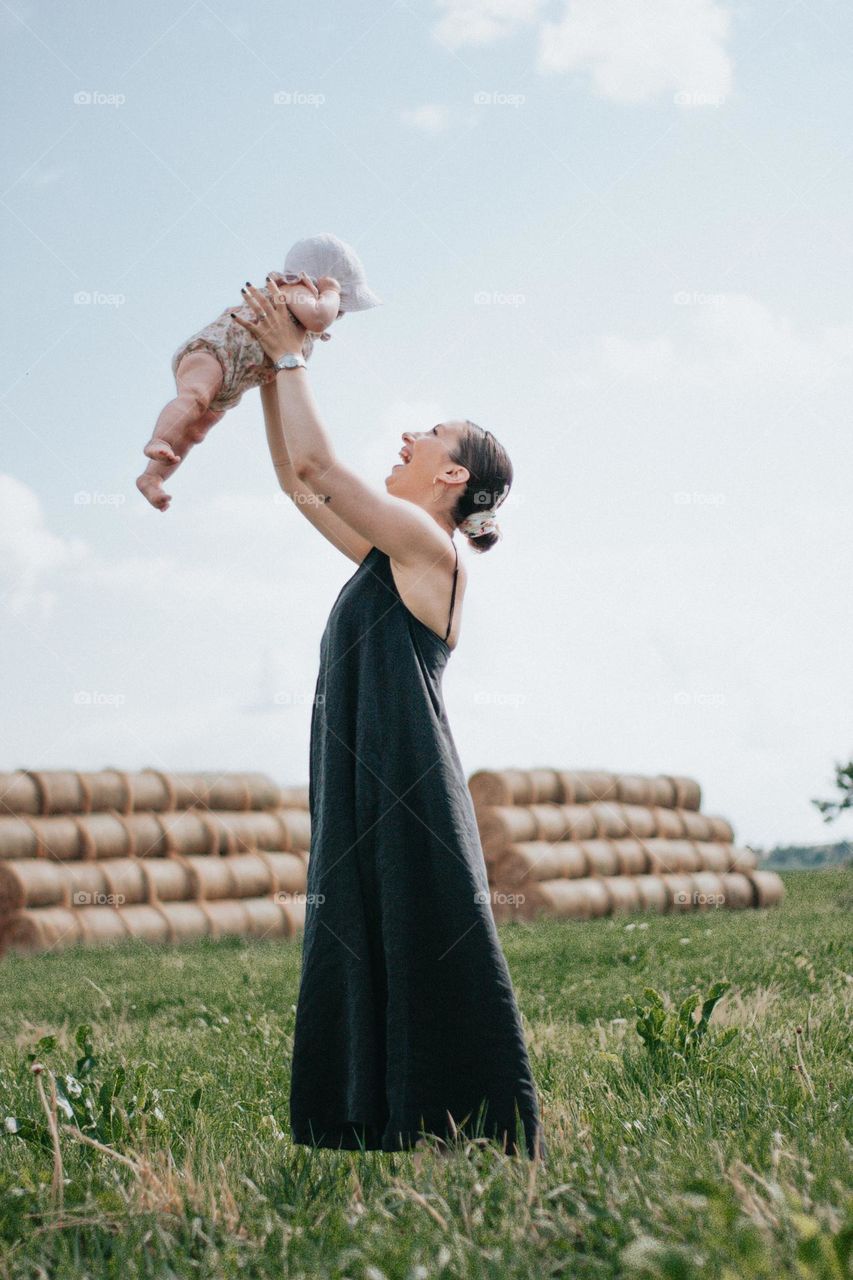 woman playing with her baby daughter