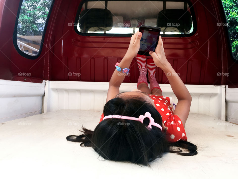 A little girl using smartphone