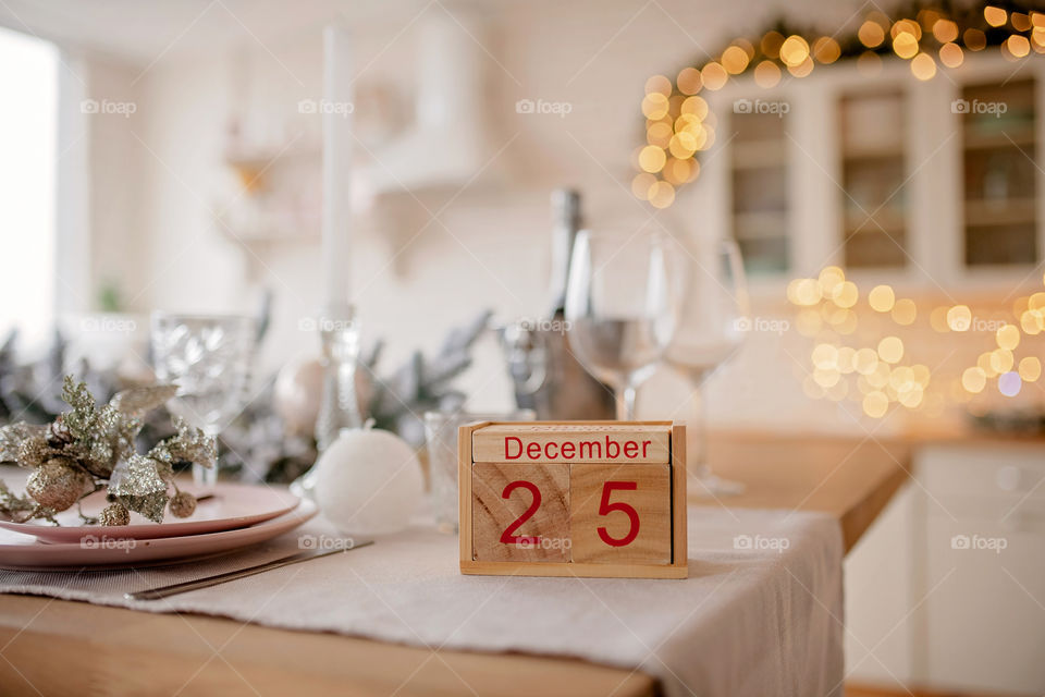 Christmas background with wooden block calendar with the date of December 25