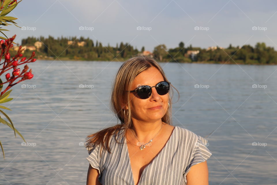 Woman standing at the sea shore