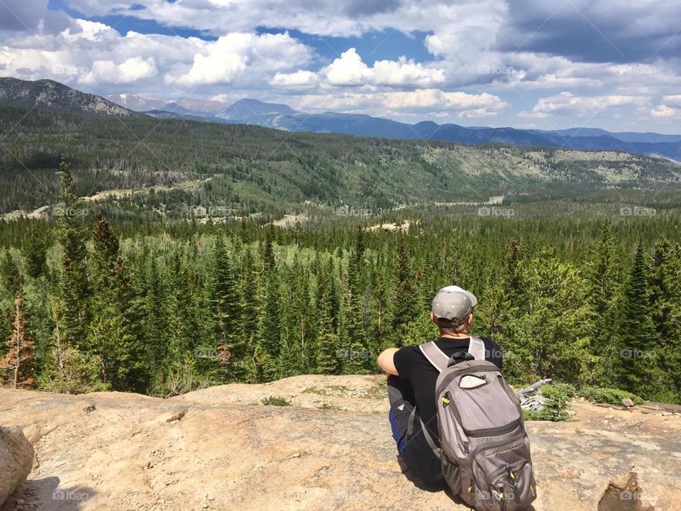 Taking in the incredible views of the Rocky Mountains in Colorado. Looking down on the greenery from thousands of feet up is breathtaking.