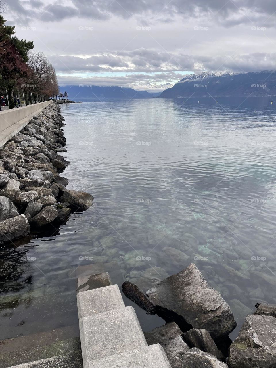 Lausanne Leman lake, Vaud, Switzerland with Snowy mountains in the back 