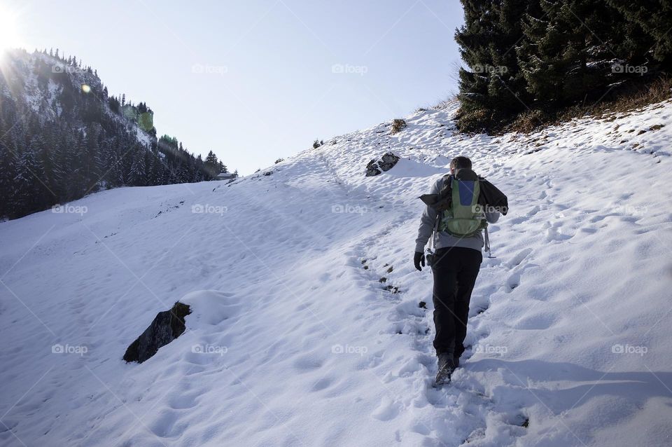 Photo of a young man hiking in the mountains 