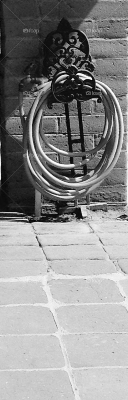 Black and white hose and holder