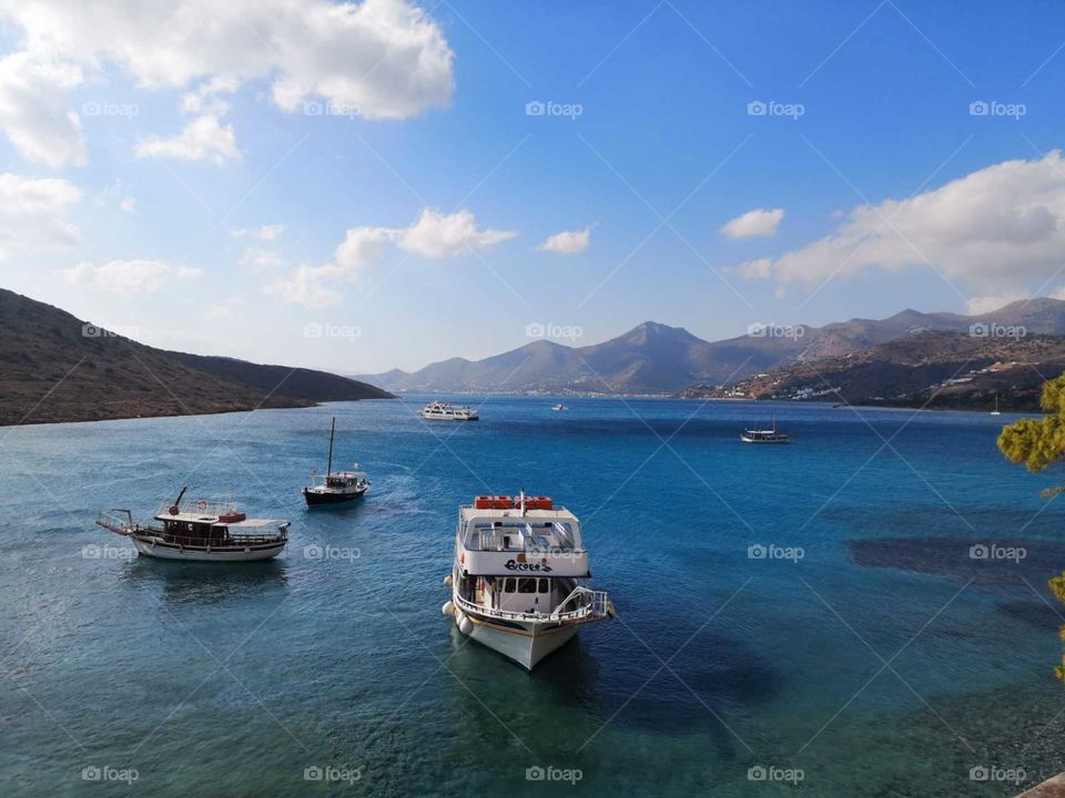 Beautiful view on the aegean sea with boats and sky from island spinalonga