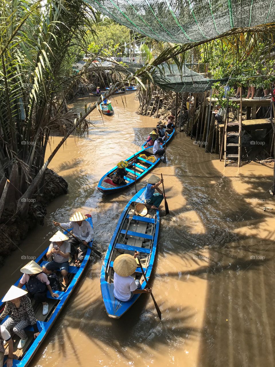Transportation in Vietnam, Ho Chi Min city,My Tho.People using little boats to transfer products or people within the river. Crocodiles used to live in these rivers, but nowdays no more of them leave there.