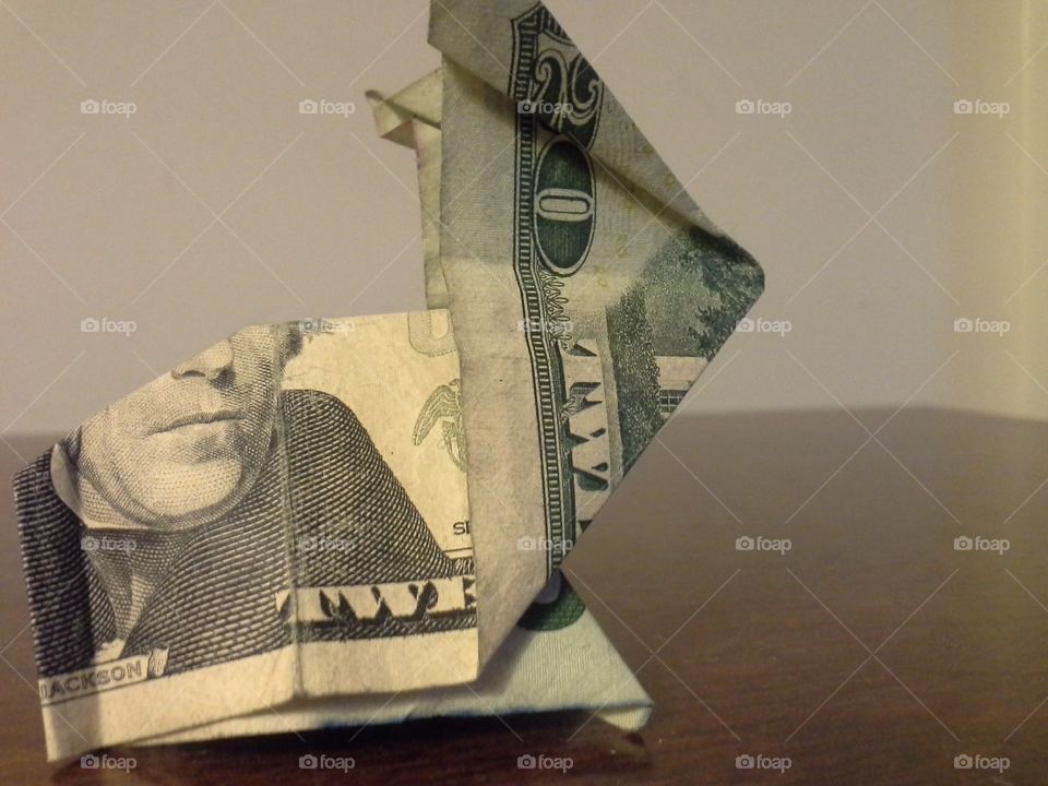 a small rabbit made of a twenty dollar bill