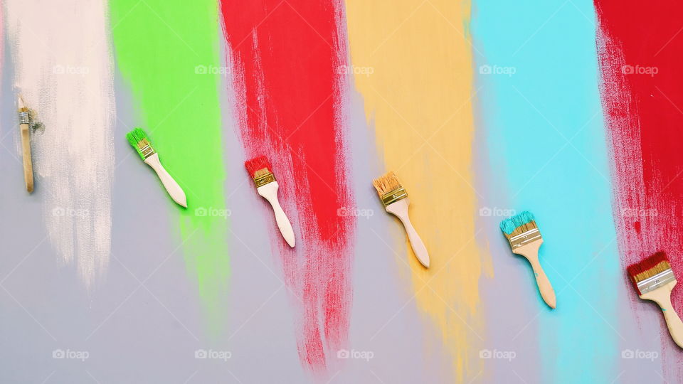 colorful paints and brushes