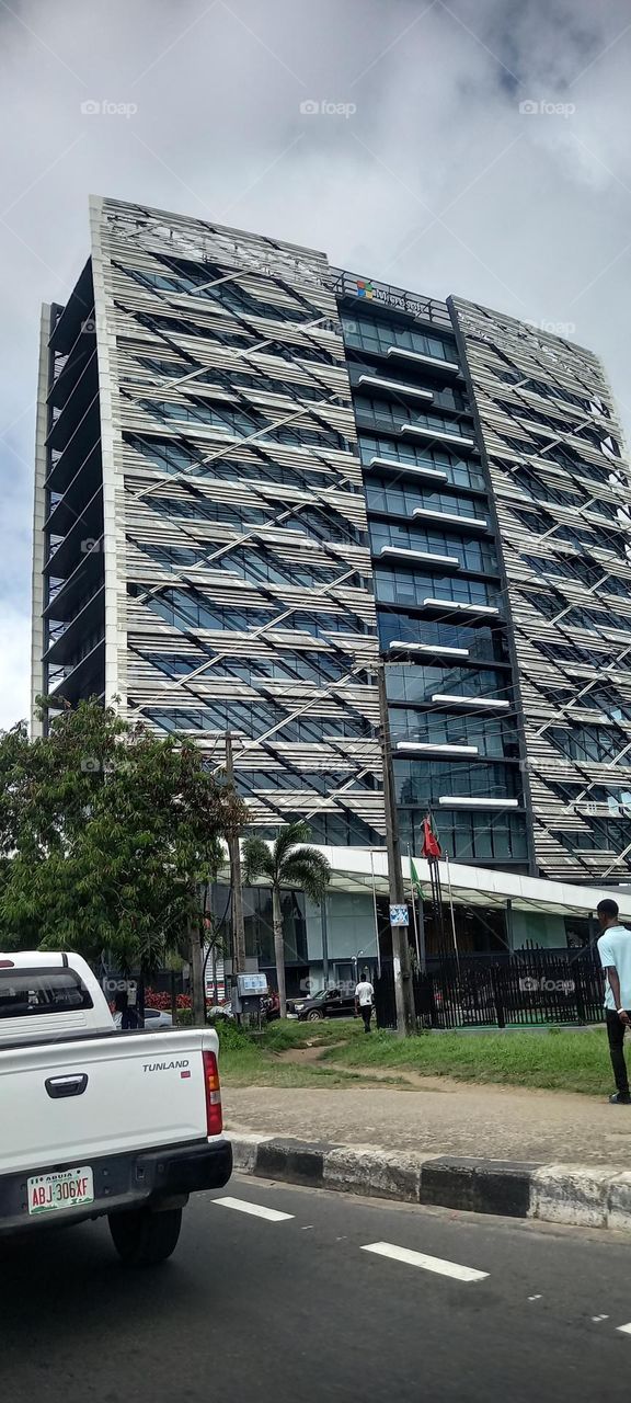 Beautiful urban skyscraper  office building with lush green plants. An architectural masterpiece