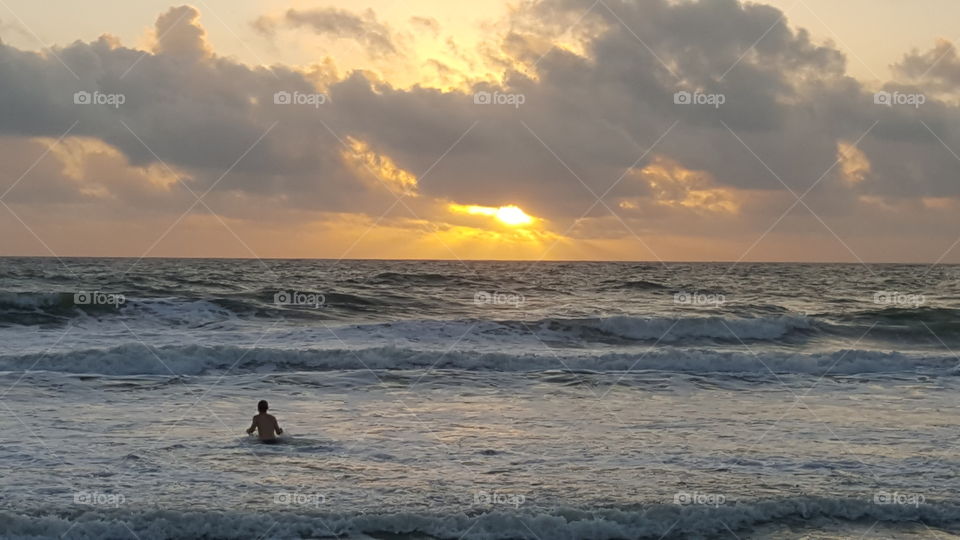 Surfing at dawn