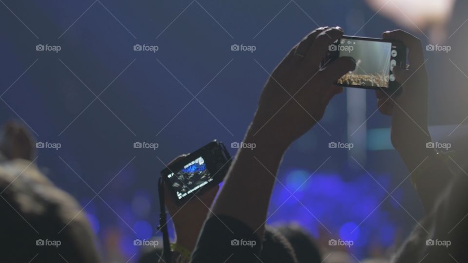 fans at a concert with phones