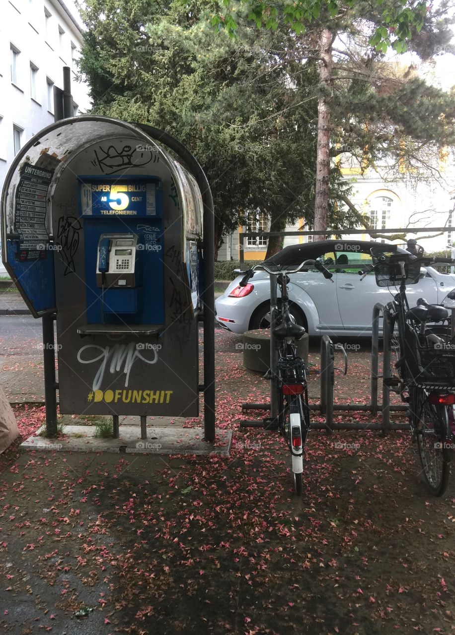 German phone kiosk with graffiti 