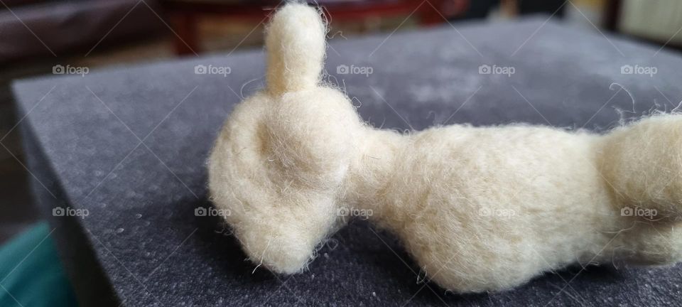needle felting a white base shape of a mouse