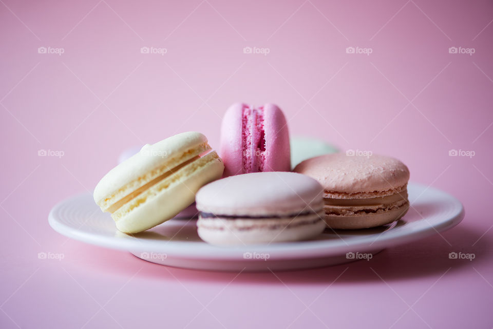 Macaroons on pink pastel background