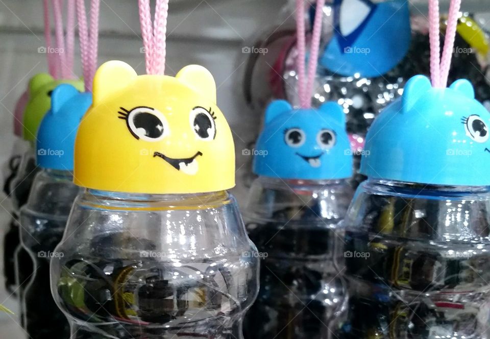 Few jars of hair tie in a store...