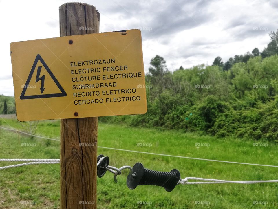 An electric fence danger sign