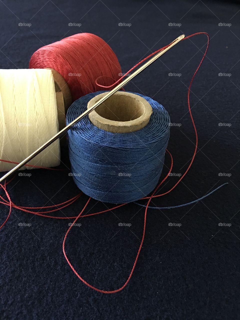 Three bolts of upholstery thread 