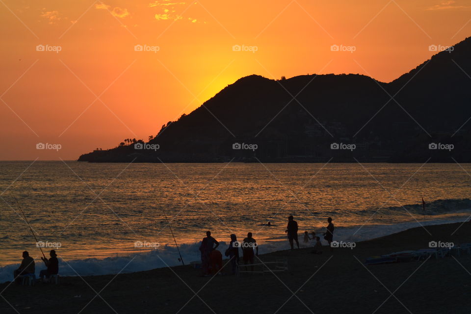 fishermen in sunset