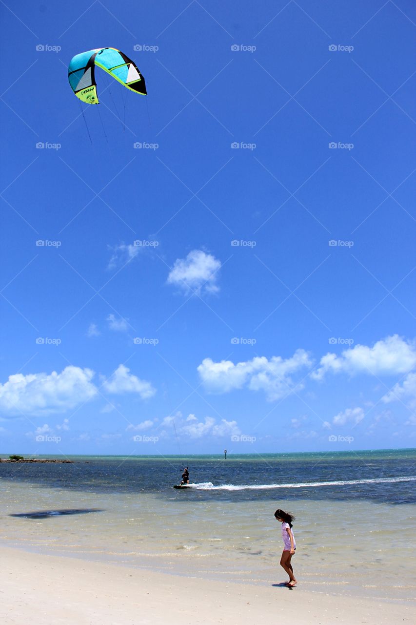 Girl on the beach, ocean, kitesurfing 