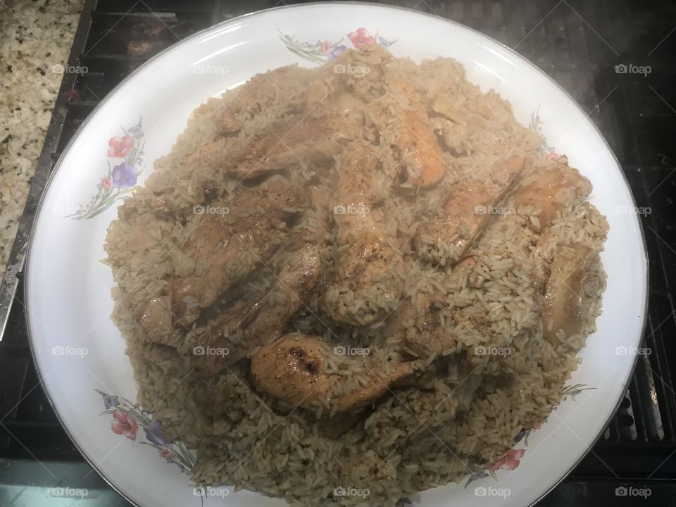 This is a Traditional dish called “Maklooba” I made with chicken Brest because my kids lol I typically make it with lamb meat .