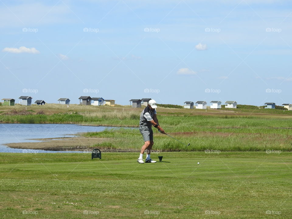 Golfer swinging