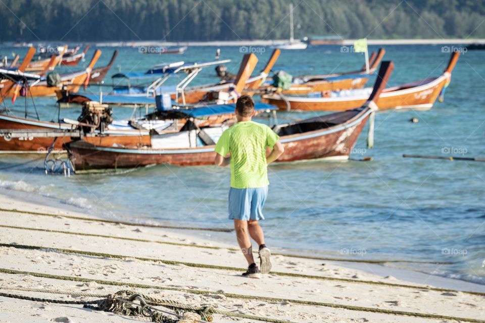 Tourist morning jogging on beautiful beach ... Koh Lipe Thailand