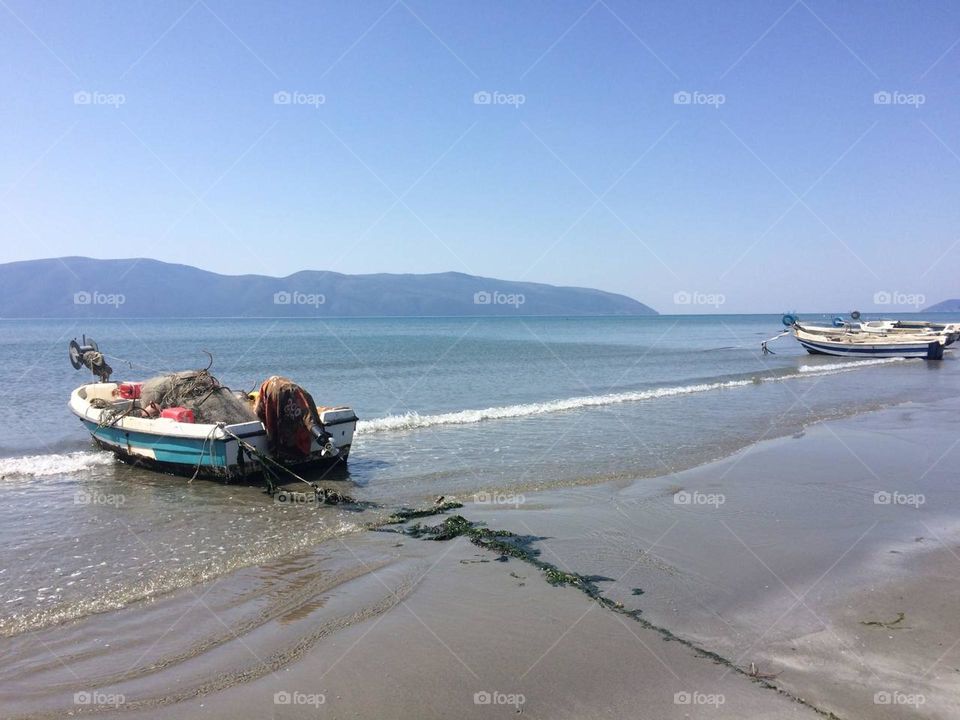 View of boats on the seashore