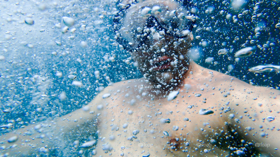 Portrait of a man swimming in underwater