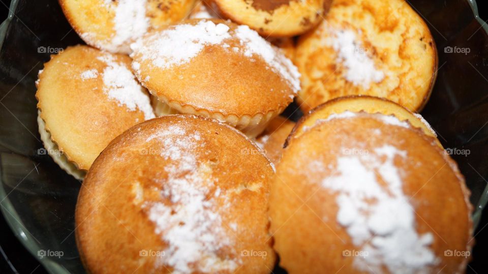 Yeast-free pastries on sour-milk products. Capkakes sprinkled with powdered sugar.