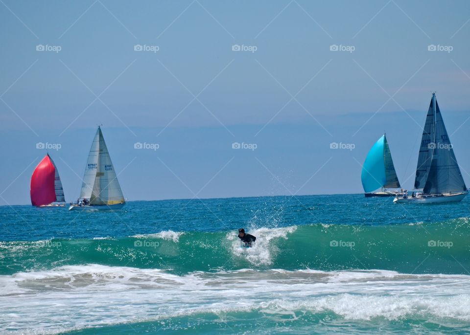 Sail, Surf and Sea. The colorful sails danced along the ocean edge. A perfect backdrop to a surfers paradise. 
