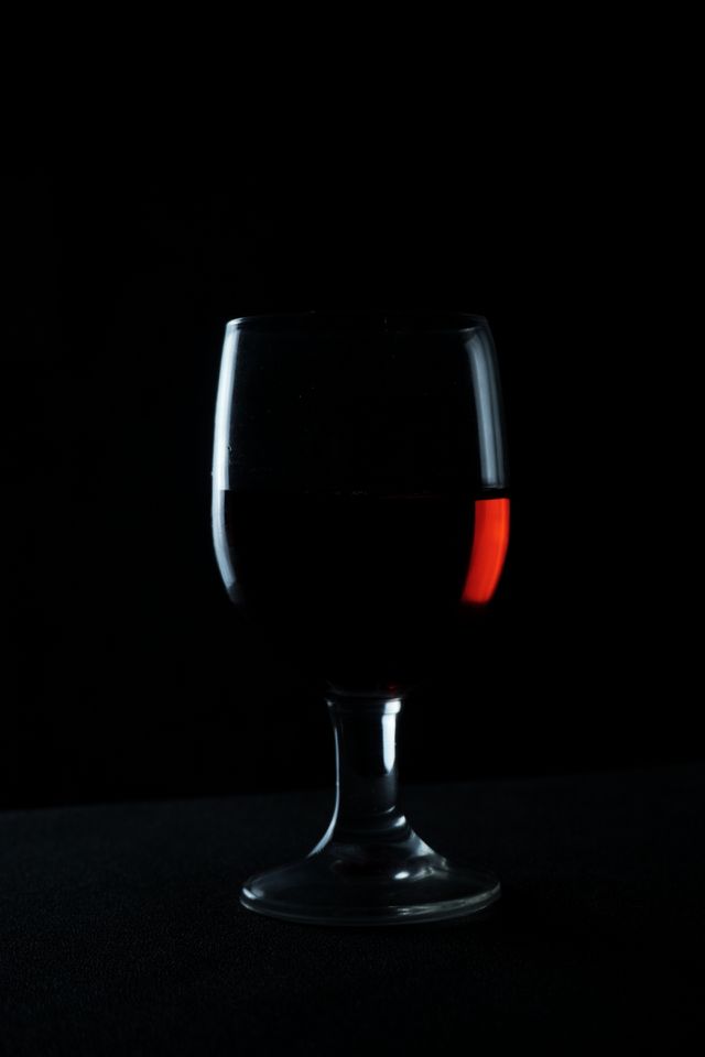 silhouette of red wine glass