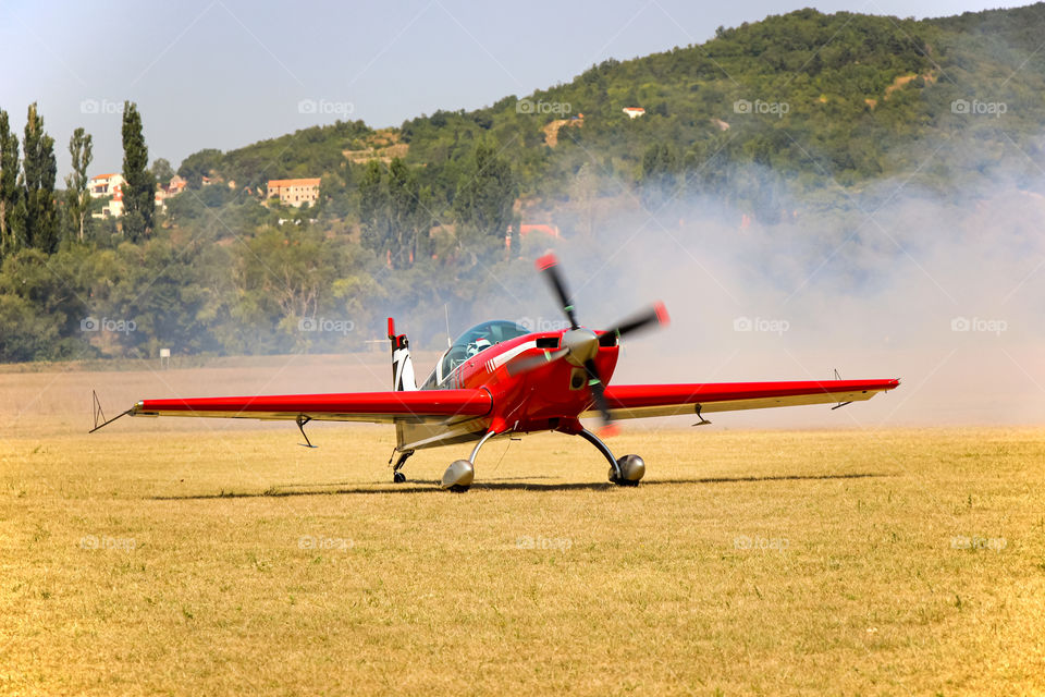 Red plane landed after acrobatic flight