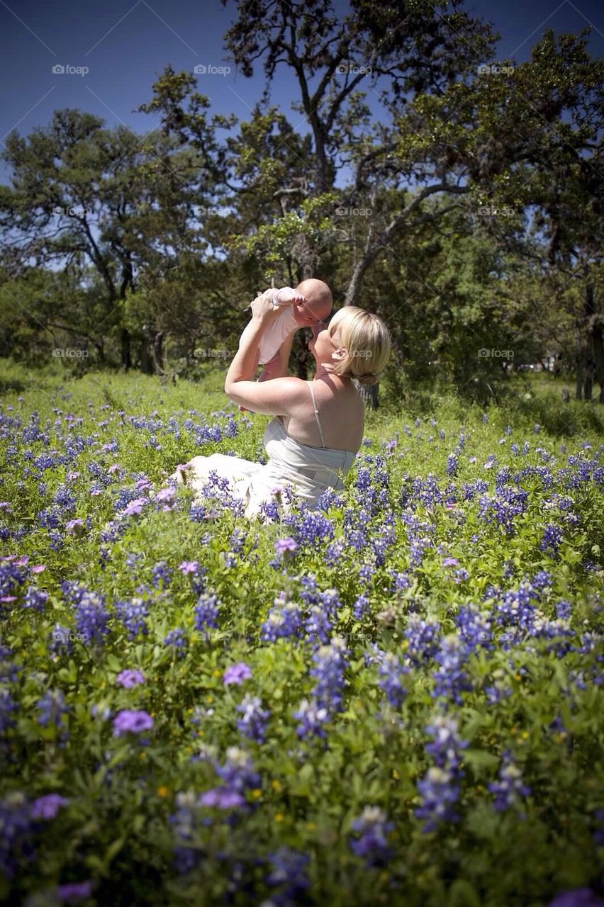 With baby in the Texas Bluebonnets