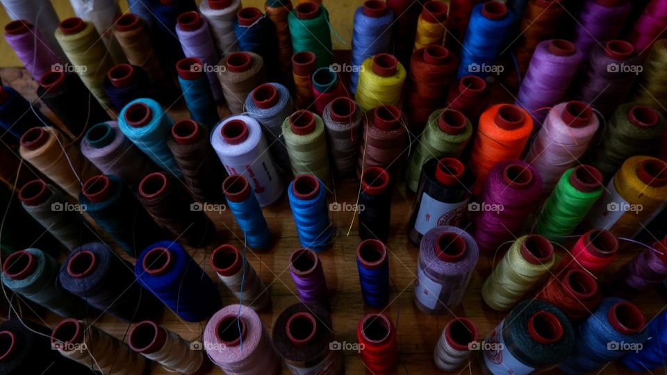 collection of sewing threads of various colors