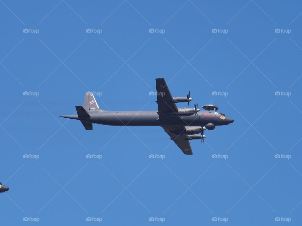 Russian anti-submarine aircraft Il-38 in flight against the background of the sky.