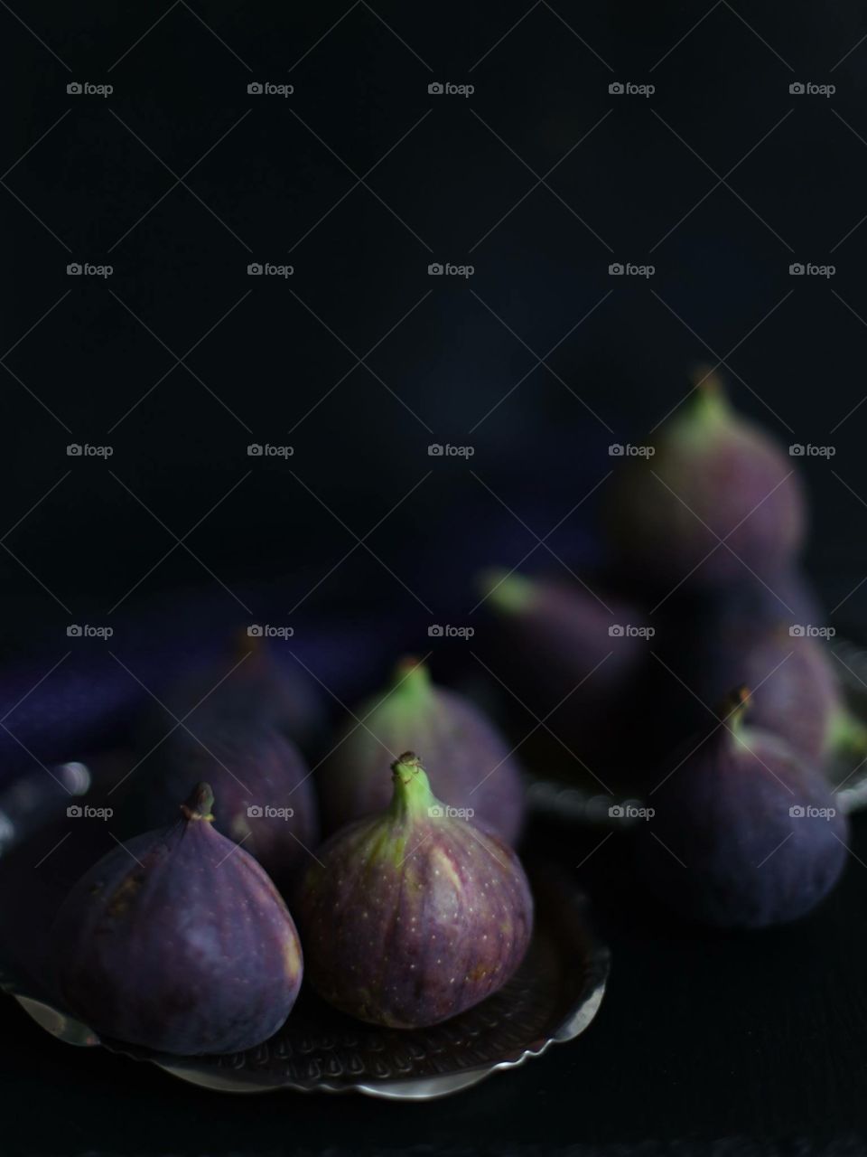 Figs against black background
