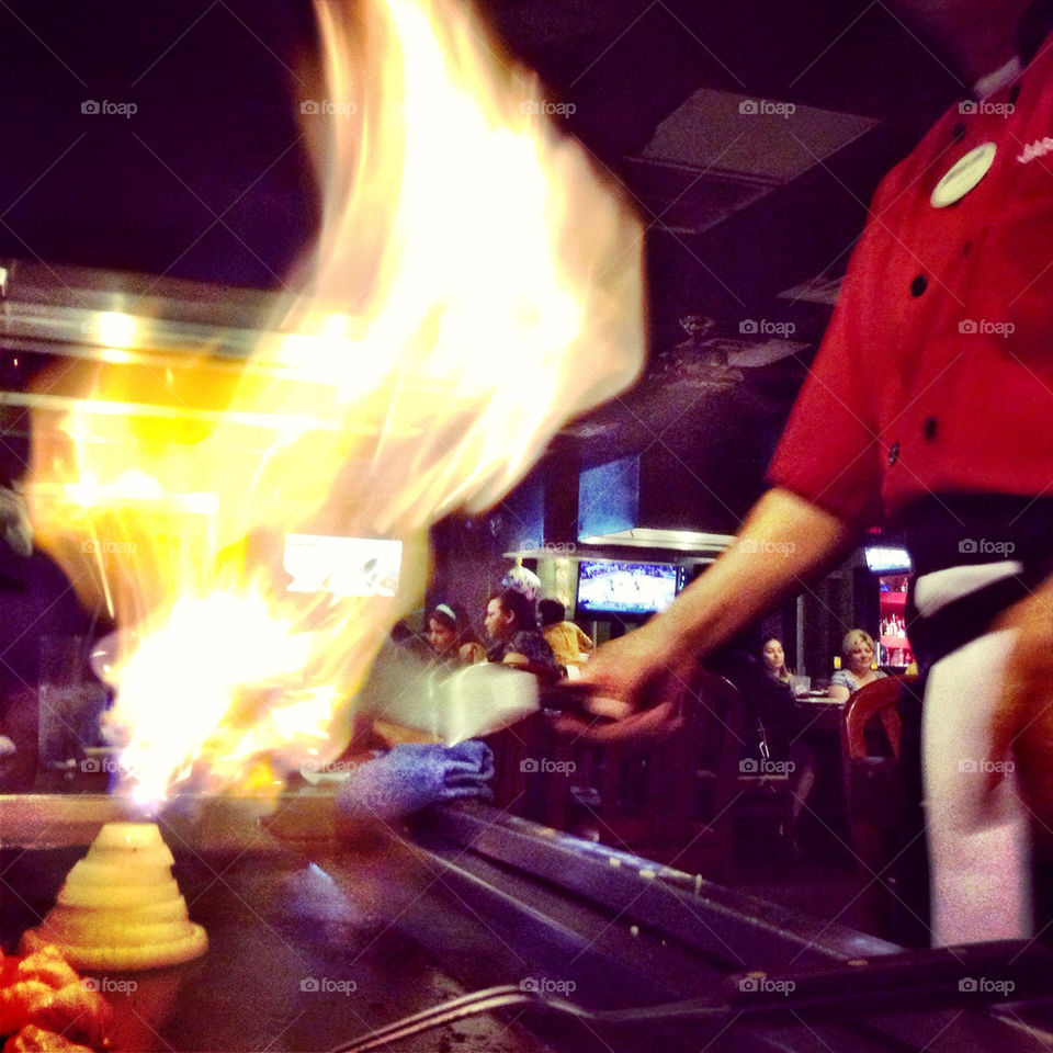 Teppanyaki chef cooking in restaurant