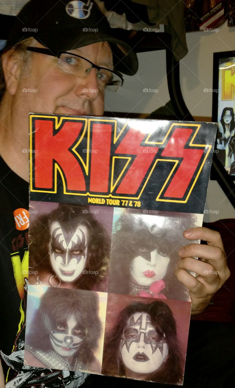 man with KISS 1977 tour program