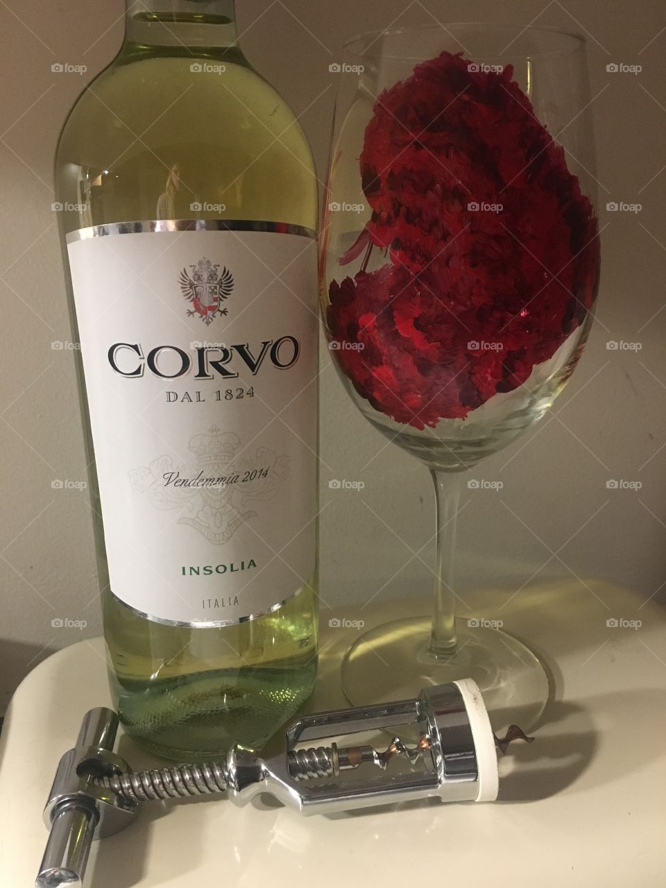 White wine in a hand painted heart wine glass 