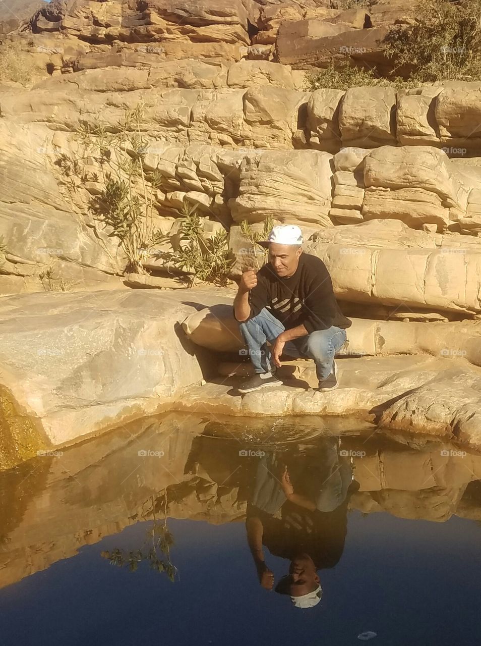 My own image is mirrored on the banks of the mountain valley