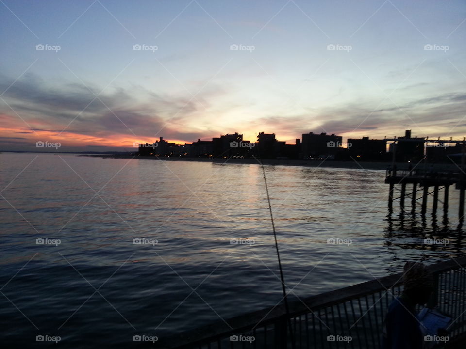 new York city ⚓ Harbor. This is a beautiful picture of a sunset near a new York city ⚓ Harbor that I saw while visiting there on vacation