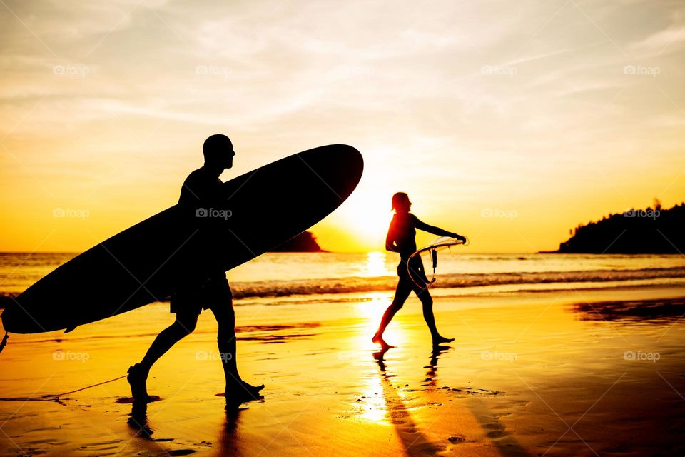 Two surfers on beach 