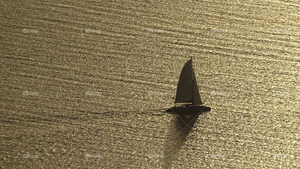 Silhouette of sailboat in the sea
